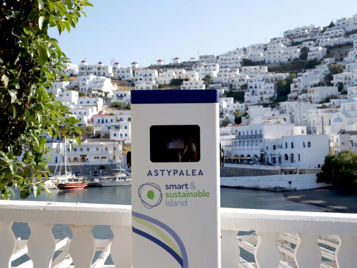 Charging station in front of white houses on island